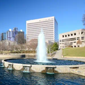 A beautiful fountain gracing the heart of a bustling city landscape.